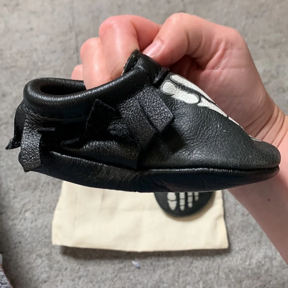 Freshly Picked Black Moccasins with White Skeleton Print